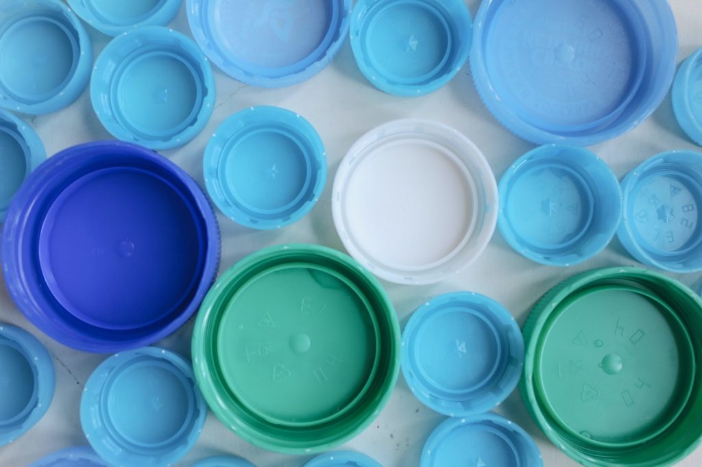 Close-up photo of plastic bottle caps made with injection blow molding